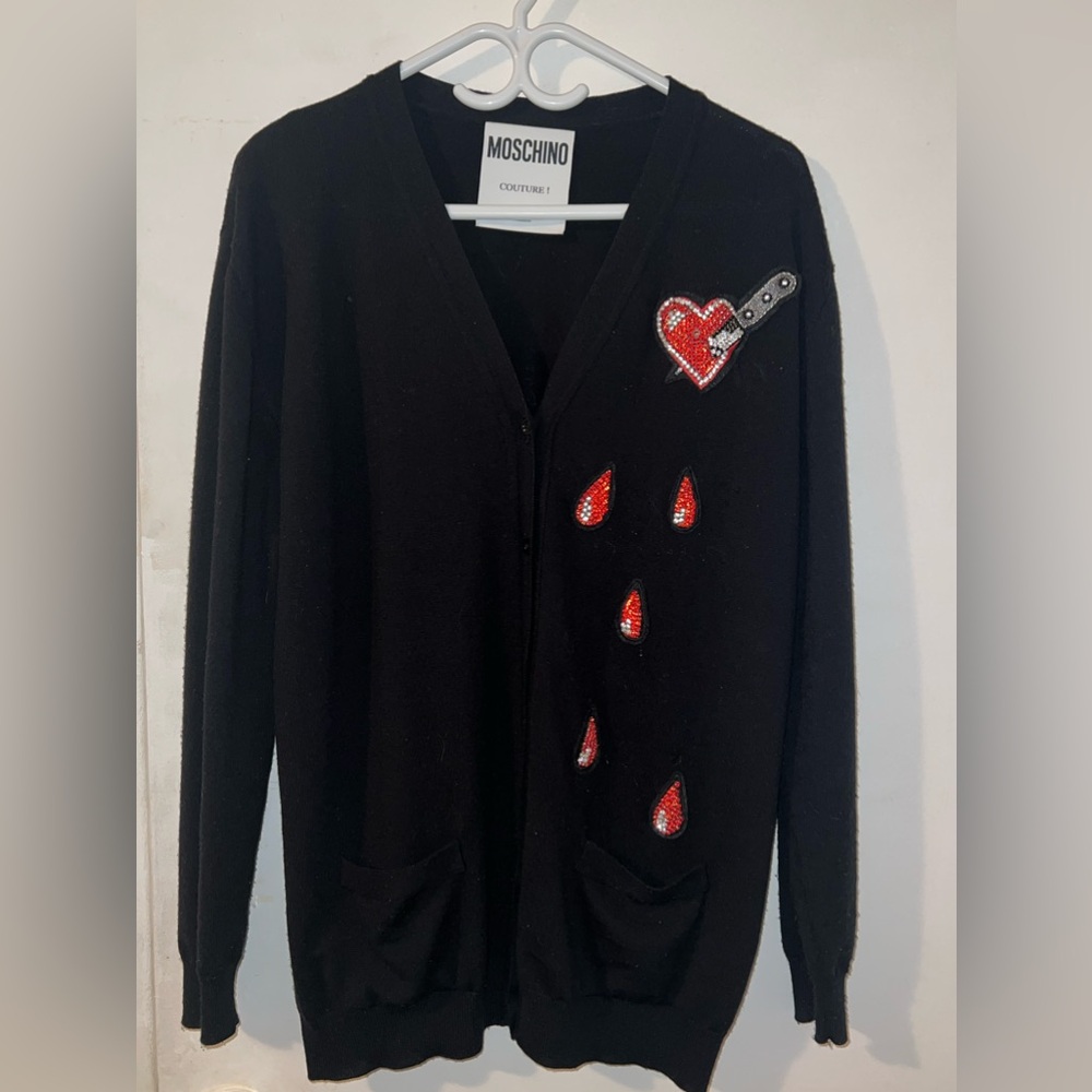 The cardigan is decorated with crystals.